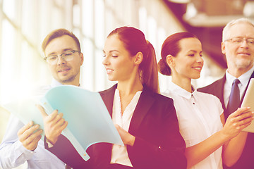 Image showing business team with folders meeting at office