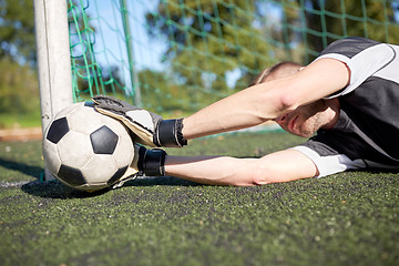 Image showing goalkeeper with ball at football goal on field