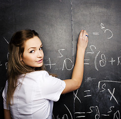 Image showing portrait of happy cute student with book in classroom