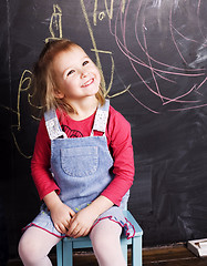 Image showing liittle cute girl in classroom near blackboard, lifestyle people concept