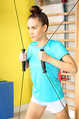 Image showing Workout at the gym. Rehabilitation, training with rubbers.