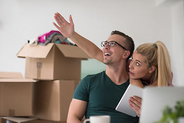 Image showing Young couple moving in a new home