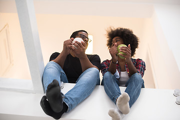 Image showing couple having break during moving to new house