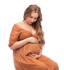 Image showing happy pregnant woman touching her big belly