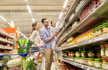 Image showing family with food in shopping cart at grocery store