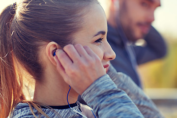 Image showing happy woman with earphones listening to music