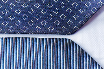 Image showing close up of blue patterned ties