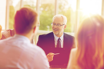 Image showing business people with laptop meeting in office