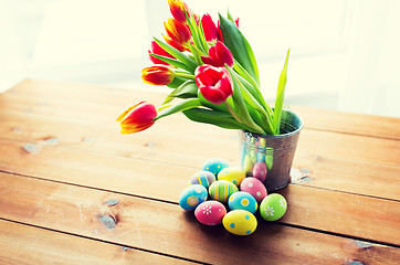 Image showing close up of easter eggs and flowers in bucket