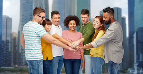 Image showing international group of happy people holding hands