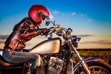 Image showing Biker girl on a motorcycle