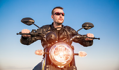 Image showing Biker on a motorcycle