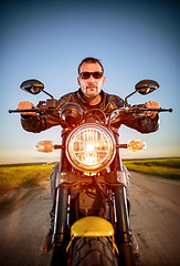 Image showing Biker on a motorcycle