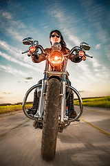 Image showing Biker girl on a motorcycle