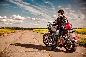 Image showing Biker girl on a motorcycle