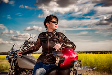 Image showing Biker girl on a motorcycle