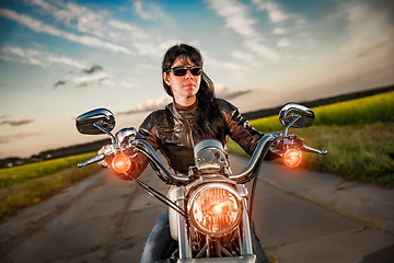 Image showing Biker girl on a motorcycle