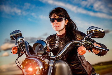 Image showing Biker girl on a motorcycle