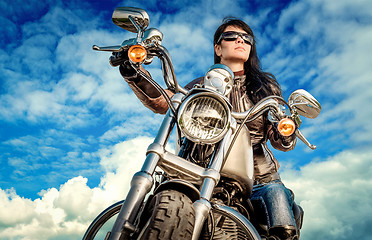 Image showing Biker girl on a motorcycle