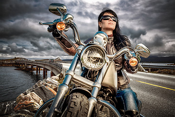 Image showing Biker girl on a motorcycle