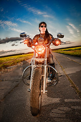 Image showing Biker girl on a motorcycle