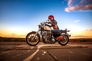 Image showing Biker girl on a motorcycle