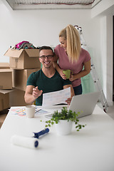 Image showing Young couple moving in a new home