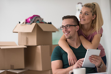 Image showing Young couple moving in a new home