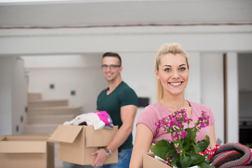 Image showing young couple moving into a new home