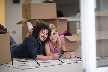 Image showing Young couple moving in a new flat