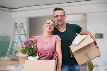 Image showing young couple moving into a new home