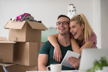 Image showing Young couple moving in a new home