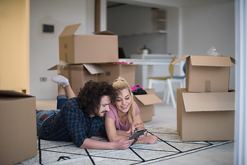 Image showing Young couple moving in a new flat