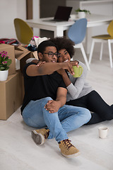 Image showing African American couple relaxing in new house