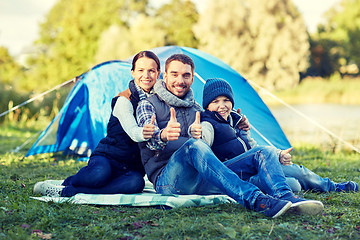 Image showing happy family with tent at camp site