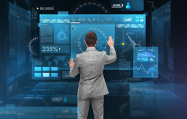 Image showing businessman working with virtual screens