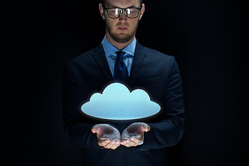 Image showing businessman with cloud projection over black 