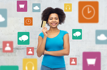 Image showing afro american woman with credit card and icons