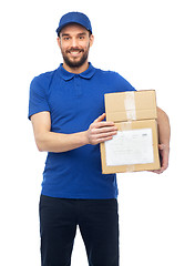 Image showing happy delivery man with parcel boxes