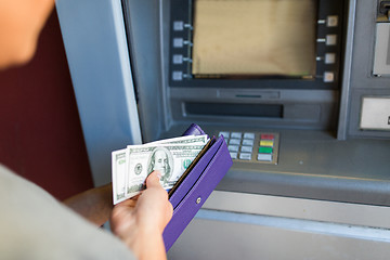 Image showing close up of hand withdrawing money at atm machine