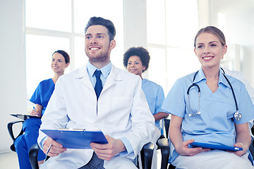 Image showing group of happy doctors on seminar at hospital