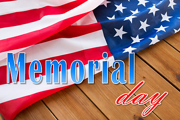 Image showing memorial day words over american flag on wood