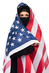 Image showing muslim woman in hijab with american flag