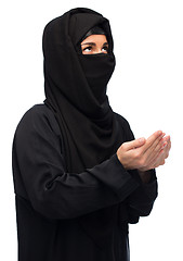 Image showing praying muslim woman in hijab over white