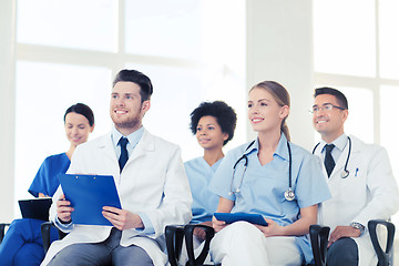 Image showing group of happy doctors on seminar at hospital