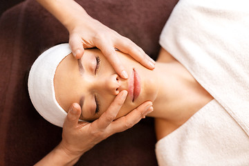 Image showing woman having face and head massage at spa