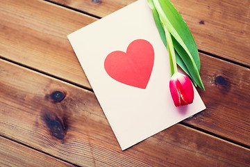 Image showing close up of flowers and greeting card with heart