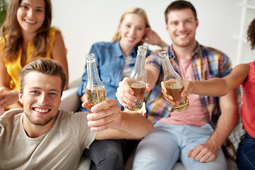 Image showing happy friends drinking beer at home party