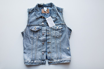 Image showing denim vest or waistcoat with price tag on white