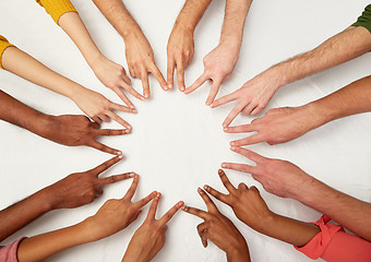 Image showing group of international people showing peace sign